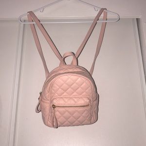 A small Light pink back pack
